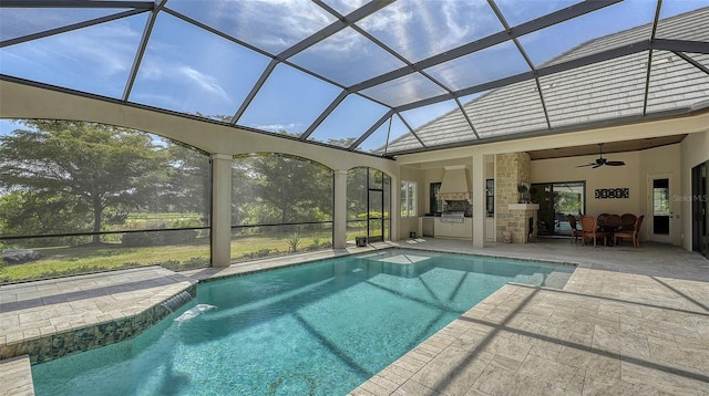 view of pool with area for grilling, ceiling fan, and a patio