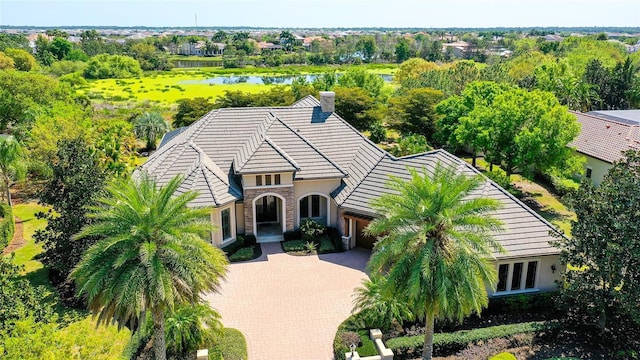 birds eye view of property with a water view