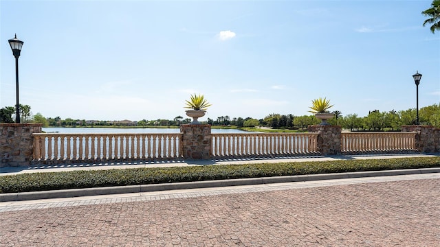 surrounding community featuring a water view