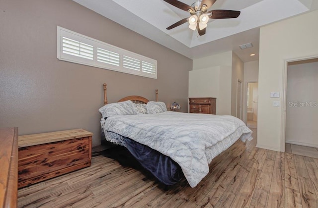 bedroom with ceiling fan and light hardwood / wood-style flooring