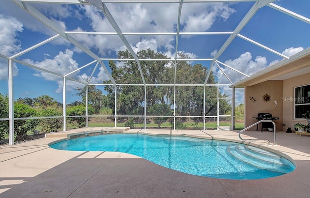 view of pool featuring a patio and glass enclosure