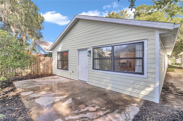 back of property featuring a patio