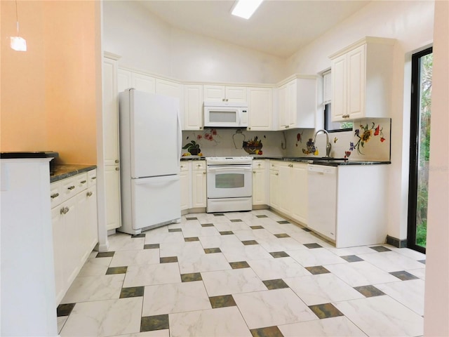 kitchen with tasteful backsplash, white cabinetry, white appliances, and lofted ceiling