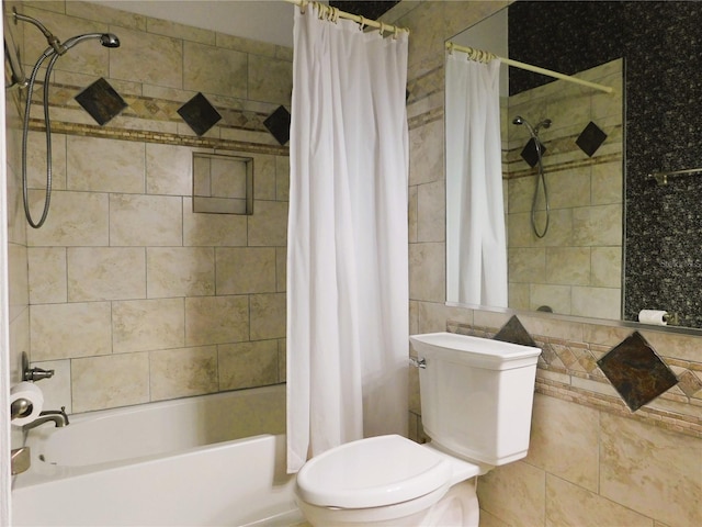 bathroom featuring toilet, tile walls, and shower / bath combination with curtain