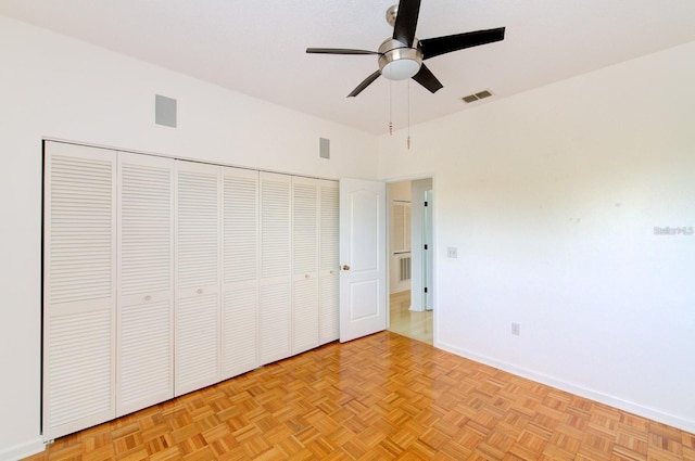 unfurnished bedroom featuring light parquet floors and ceiling fan