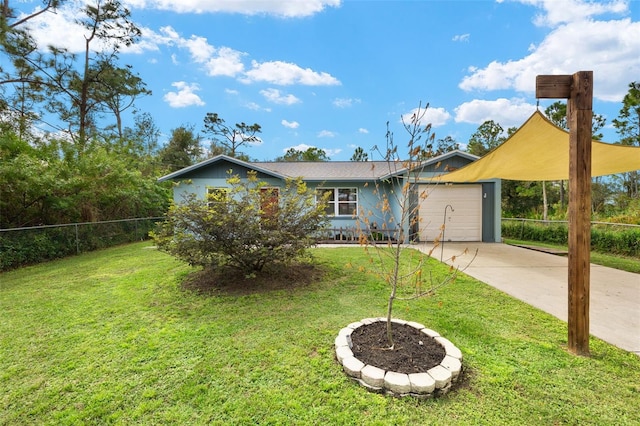 view of front of property featuring a front yard and a garage