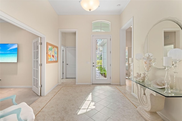 12121 Thornhill Ct, Lakewood Ranch, FL 34202 - entryway with light tile patterned flooring, crown molding, and baseboards