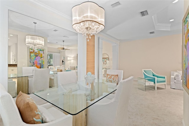 carpeted dining room with crown molding and ceiling fan with notable chandelier