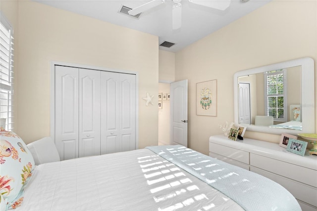 bedroom featuring ceiling fan and a closet