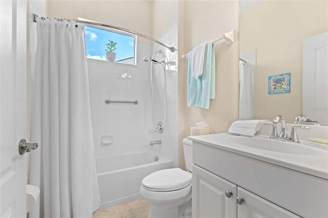 full bathroom with vanity, shower / tub combo, and toilet