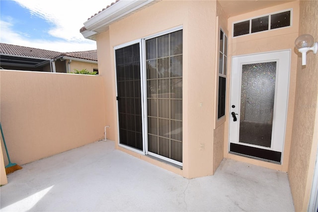 property entrance with a patio area