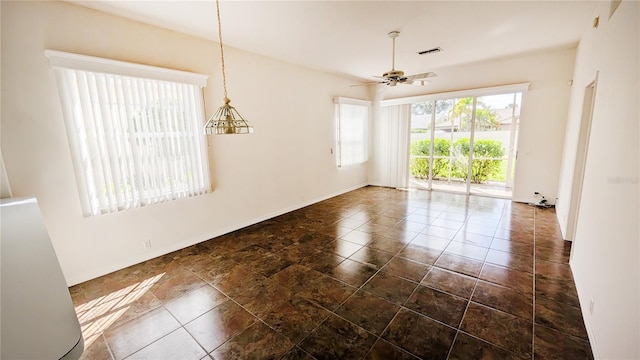 spare room with ceiling fan