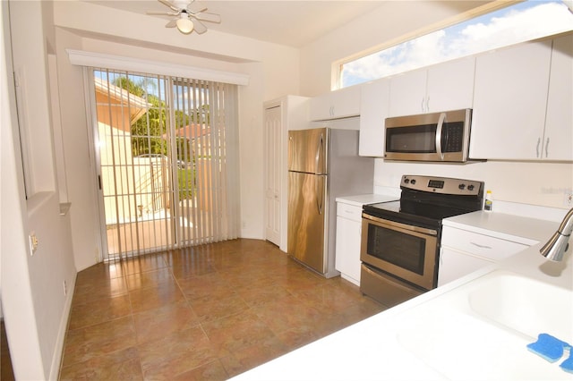 kitchen featuring white cabinetry, stainless steel appliances, and ceiling fan