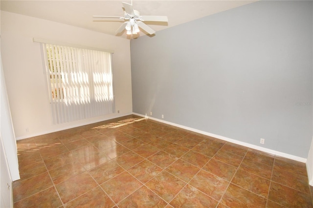 tiled empty room with ceiling fan