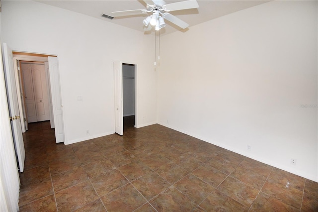 unfurnished bedroom featuring ceiling fan