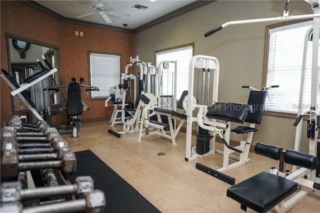 gym with ceiling fan and ornamental molding