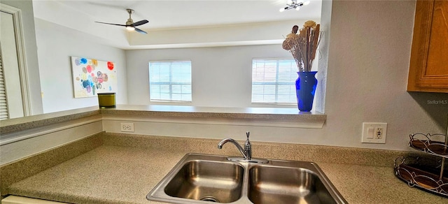 kitchen with ceiling fan and sink