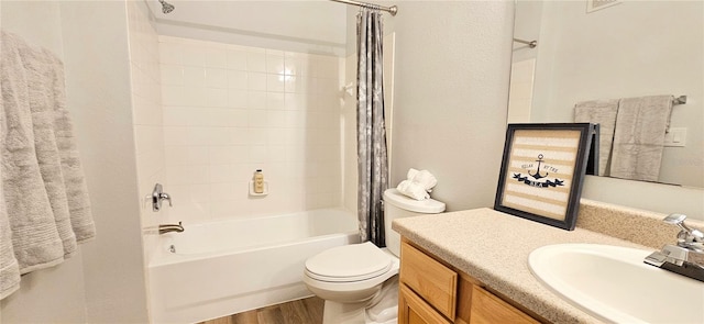 full bathroom with toilet, wood-type flooring, vanity, and shower / bath combo with shower curtain