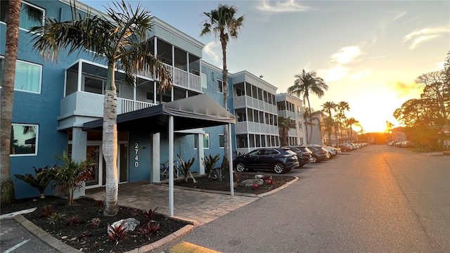 outdoor building at dusk with a carport