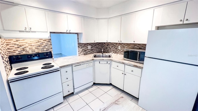 kitchen with decorative backsplash, sink, light tile patterned flooring, white cabinetry, and white appliances