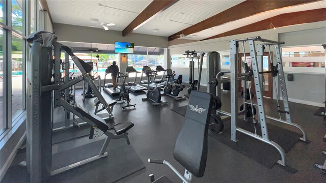 gym with ceiling fan and vaulted ceiling