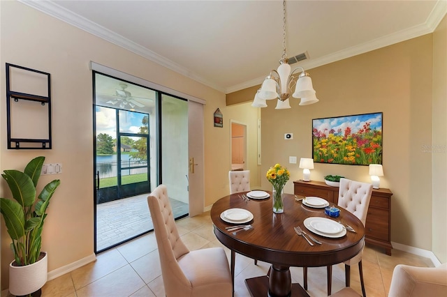 tiled dining room featuring ornamental molding and ceiling fan with notable chandelier