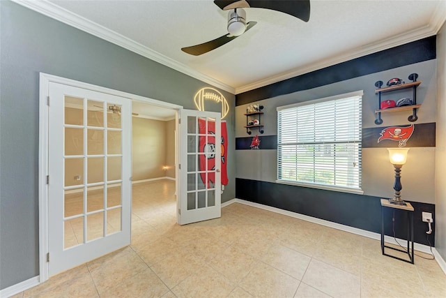 empty room featuring ornamental molding, french doors, and ceiling fan