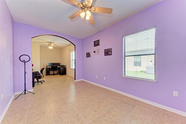 home office featuring a healthy amount of sunlight and ceiling fan