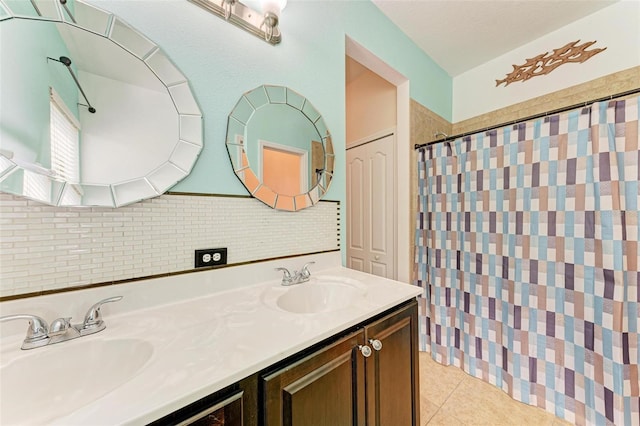 bathroom featuring vanity, curtained shower, and tile patterned flooring