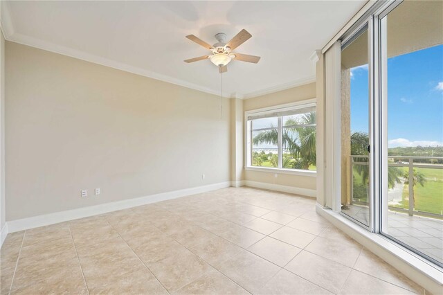 spare room featuring crown molding, light tile patterned flooring, and ceiling fan