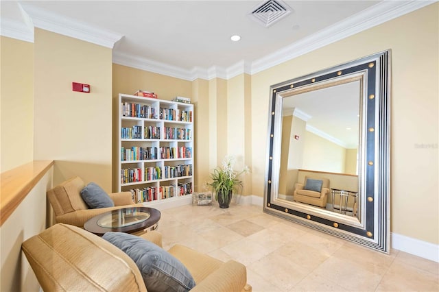 sitting room with ornamental molding and tile patterned flooring