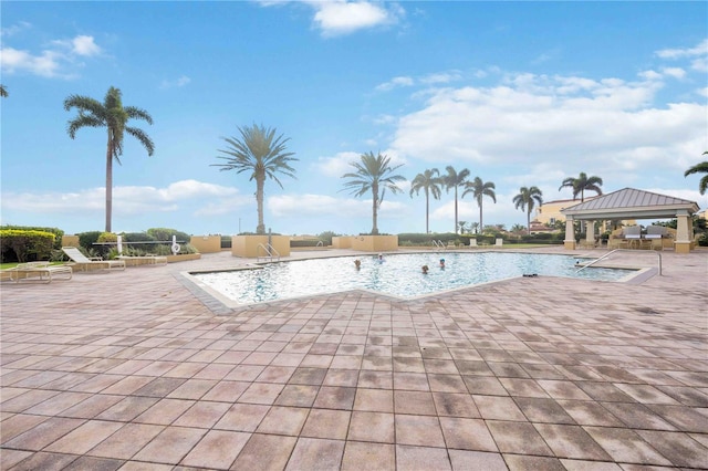 view of pool with a patio and a gazebo