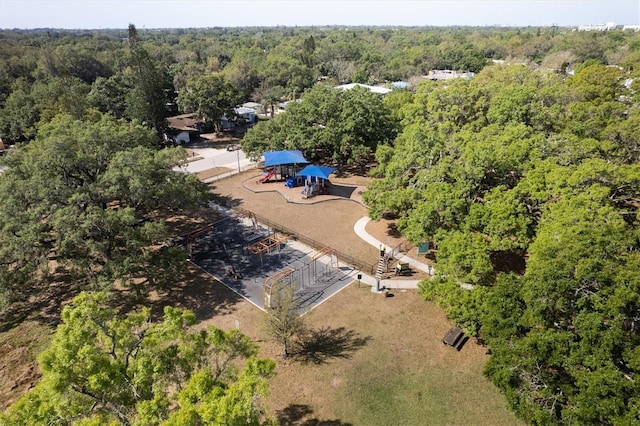 drone / aerial view featuring a wooded view