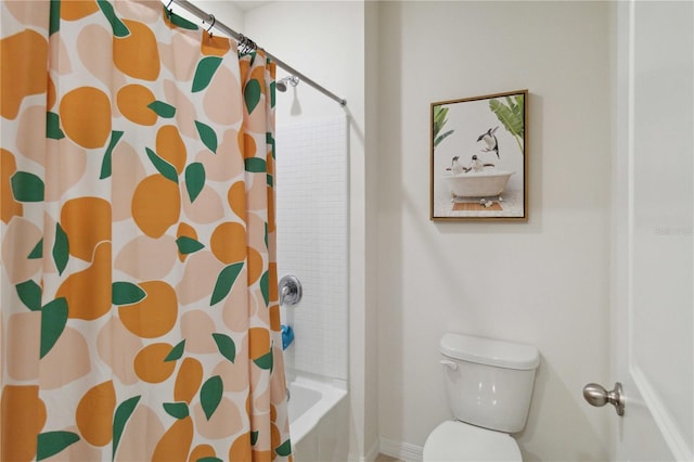 bathroom with toilet and shower / bath combo