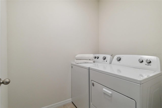 laundry area with separate washer and dryer