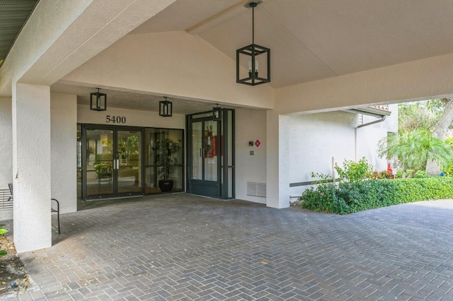 property entrance featuring french doors