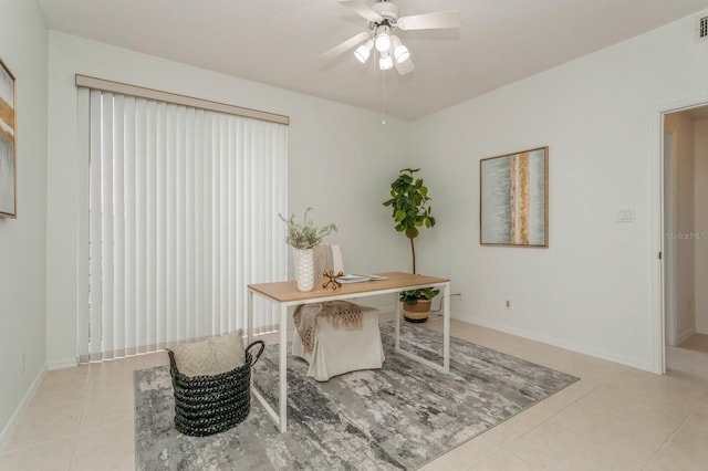 office area featuring a textured ceiling, ceiling fan, and light tile patterned floors