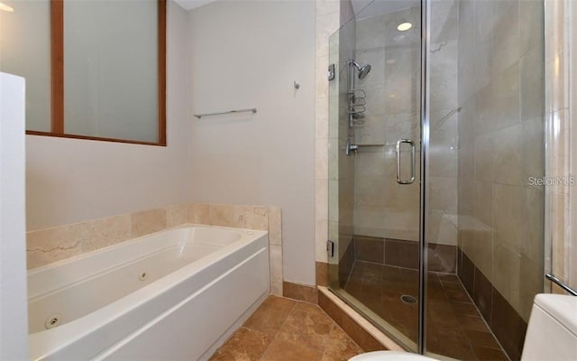 full bathroom with toilet, a tub with jets, and a shower stall