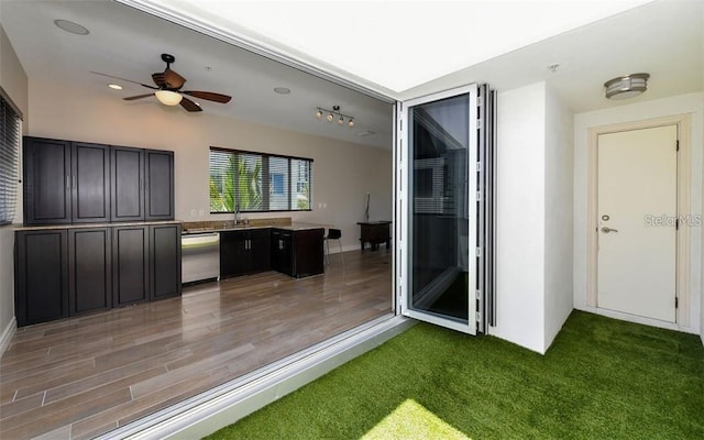 interior space featuring a sink and ceiling fan