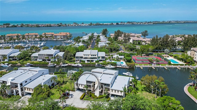 birds eye view of property with a water view