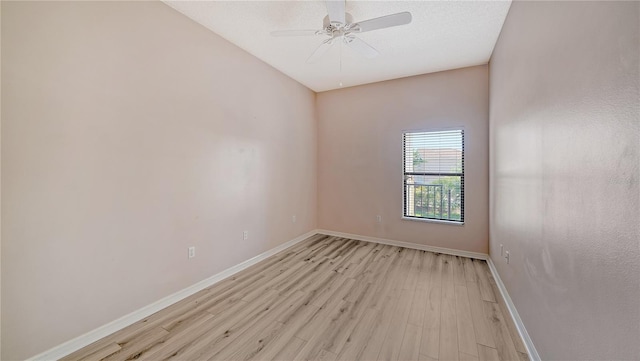 empty room with light hardwood / wood-style flooring and ceiling fan