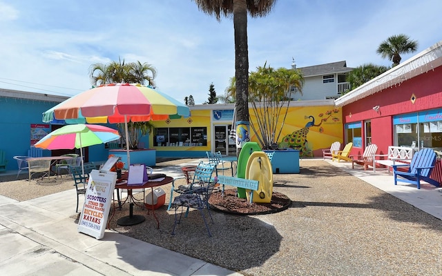 view of playground featuring a patio area