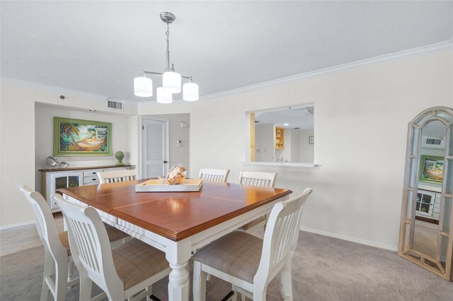 carpeted dining space with ceiling fan with notable chandelier and crown molding