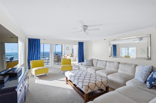 living room featuring carpet floors, a water view, ceiling fan, and crown molding