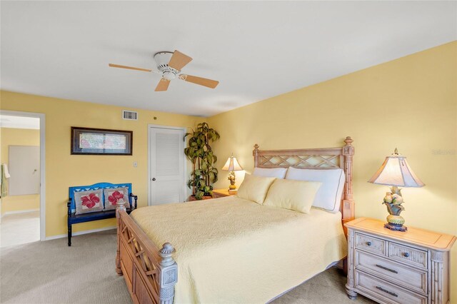 carpeted bedroom with ceiling fan