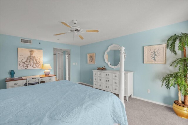 bedroom with ceiling fan and light colored carpet