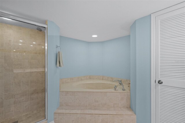 bathroom with separate shower and tub