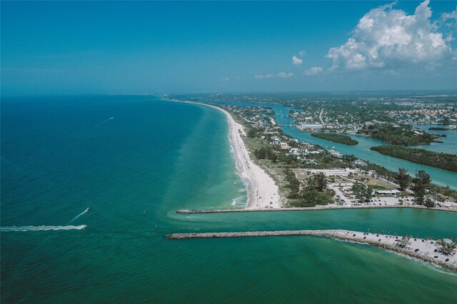 aerial view featuring a water view and a view of the beach