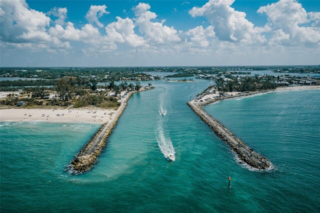 bird's eye view featuring a water view and a view of the beach