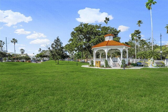 surrounding community with a gazebo and a lawn